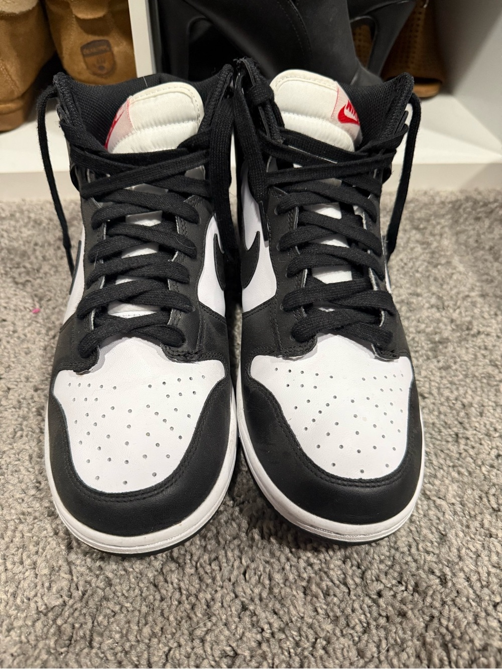 Nike Black and White High-Top Sneakers with Red Tongue Logo